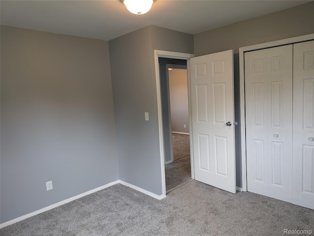 190 Main St, Sebewaing, MI 48759 - unfurnished bedroom with carpet floors, baseboards, and a closet