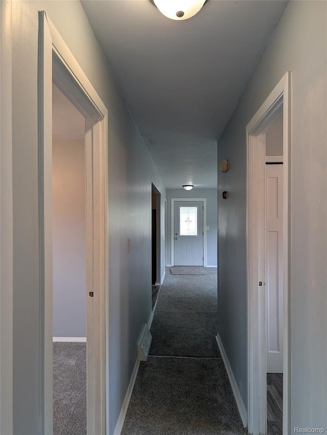 190 Main St, Sebewaing, MI 48759 - hall featuring dark colored carpet and baseboards