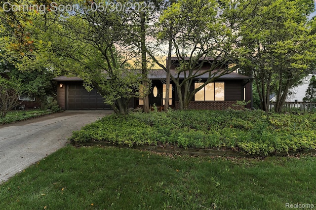 5772 Perrytown Dr, West Bloomfield, MI 48322 - mid-century inspired home with concrete driveway, an attached garage, and brick siding