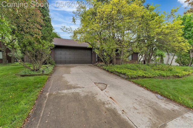 5772 Perrytown Dr, West Bloomfield, MI 48322 - view of front of house with driveway, a front yard, an attached garage, and brick siding