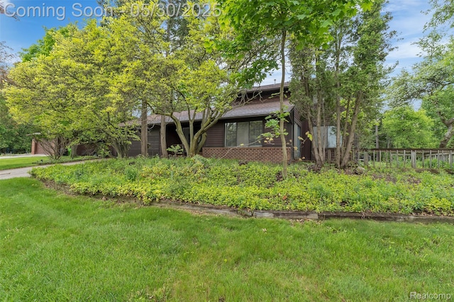 5772 Perrytown Dr, West Bloomfield, MI 48322 - view of front of home with brick siding and a front yard