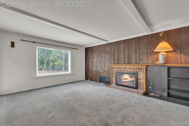 5772 Perrytown Dr, West Bloomfield, MI 48322 - unfurnished living room with wooden walls, a brick fireplace, beamed ceiling, and carpet
