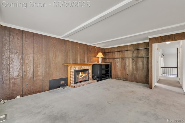 5772 Perrytown Dr, West Bloomfield, MI 48322 - unfurnished living room with wood walls, a brick fireplace, and carpet