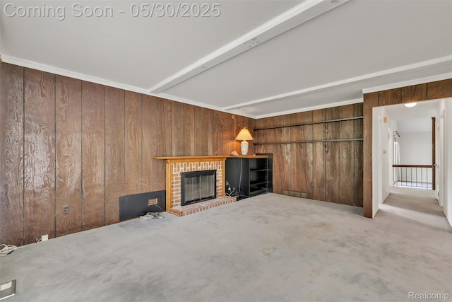 5772 Perrytown Dr, West Bloomfield, MI 48322 - unfurnished living room with wooden walls, carpet floors, a fireplace, and beamed ceiling