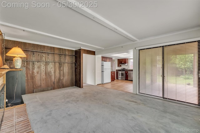 5772 Perrytown Dr, West Bloomfield, MI 48322 - unfurnished living room with wooden walls, light carpet, and beamed ceiling