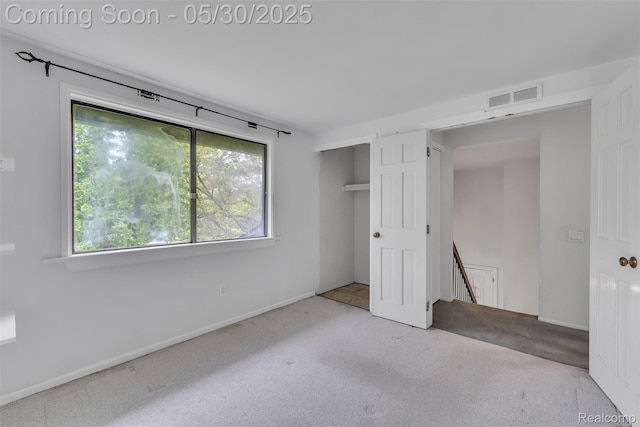 5772 Perrytown Dr, West Bloomfield, MI 48322 - unfurnished bedroom with multiple windows, a closet, and baseboards