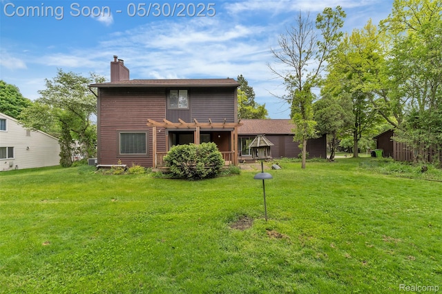 5772 Perrytown Dr, West Bloomfield, MI 48322 - rear view of property featuring a chimney and a yard