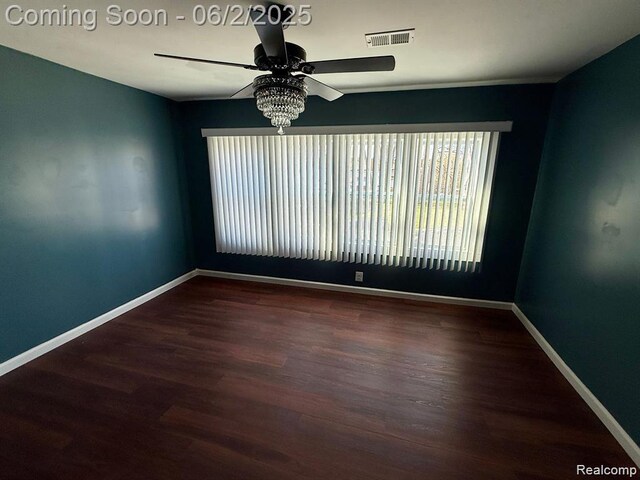 8419 Paige, Warren, MI 48089 - spare room featuring a ceiling fan, baseboards, and wood finished floors