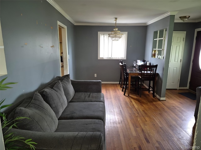 30102 Matthew St, Redford, MI 48186 - living area featuring a chandelier, wood finished floors, crown molding, and baseboards