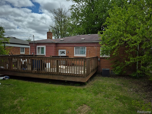 30102 Matthew St, Redford, MI 48186 - back of property with a chimney, a lawn, a wooden deck, and brick siding
