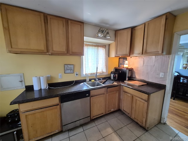 30102 Matthew St, Redford, MI 48186 - kitchen featuring dishwasher, a sink, light tile patterned flooring, dark countertops, and tasteful backsplash