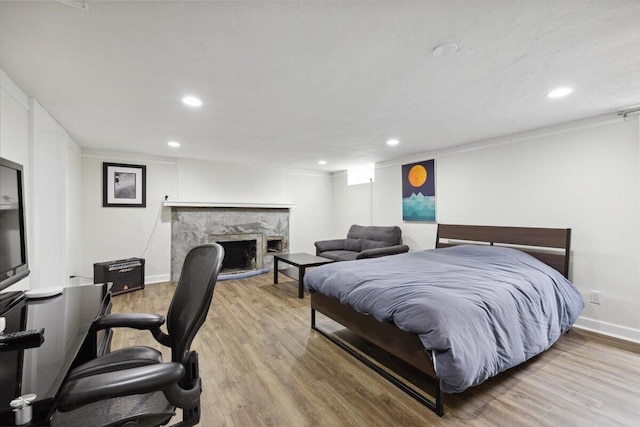 3364 Inman St, Ferndale, MI 48220 - bedroom featuring recessed lighting, wood finished floors, a high end fireplace, and baseboards