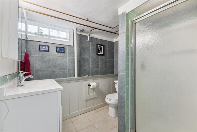 3364 Inman St, Ferndale, MI 48220 - full bathroom with tile patterned flooring, vanity, toilet, a stall shower, and tile walls