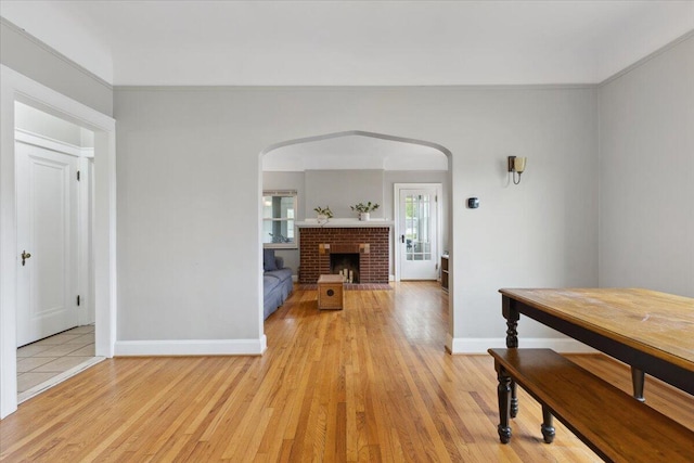3364 Inman St, Ferndale, MI 48220 - hallway with baseboards, arched walkways, and light wood finished floors