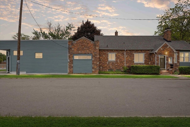 3364 Inman St, Ferndale, MI 48220 - view of front of home with a chimney, brick siding, and a shingled roof