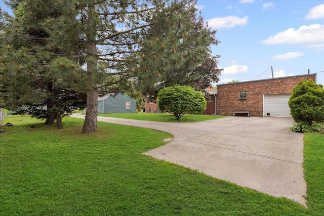 3364 Inman St, Ferndale, MI 48220 - view of green lawn with driveway and a garage