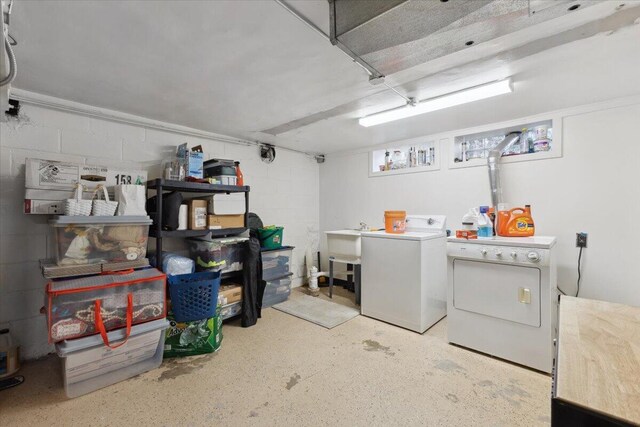 3364 Inman St, Ferndale, MI 48220 - laundry area featuring washer and clothes dryer and concrete block wall