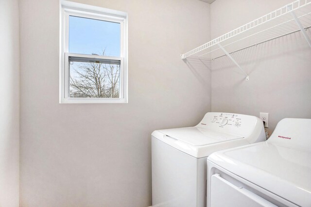 521 Snow Pine Ct NE, Cedar Springs, MI 49319 - laundry room with washing machine and clothes dryer