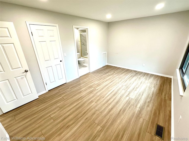 31404 Hunters Circle Dr, Farmington, MI 48334 - unfurnished bedroom featuring recessed lighting, wood finished floors, ensuite bath, and baseboards