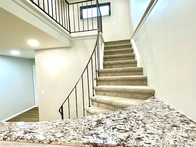 31404 Hunters Circle Dr, Farmington, MI 48334 - stairs featuring wood finished floors and a high ceiling