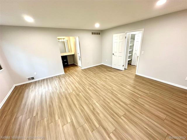 31404 Hunters Circle Dr, Farmington, MI 48334 - empty room featuring recessed lighting, baseboards, and light wood finished floors