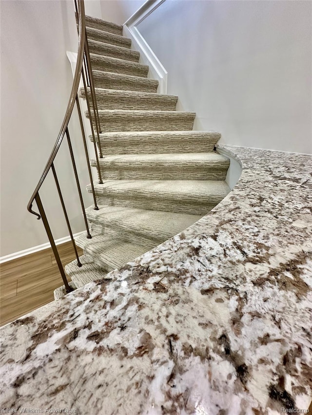 31404 Hunters Circle Dr, Farmington, MI 48334 - staircase with wood finished floors and baseboards