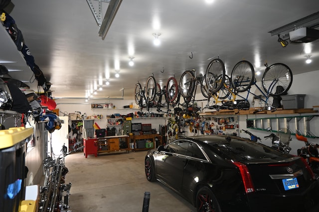 5830 Oneil St, Twin Lake, MI 49457 - garage with a workshop area and a garage door opener