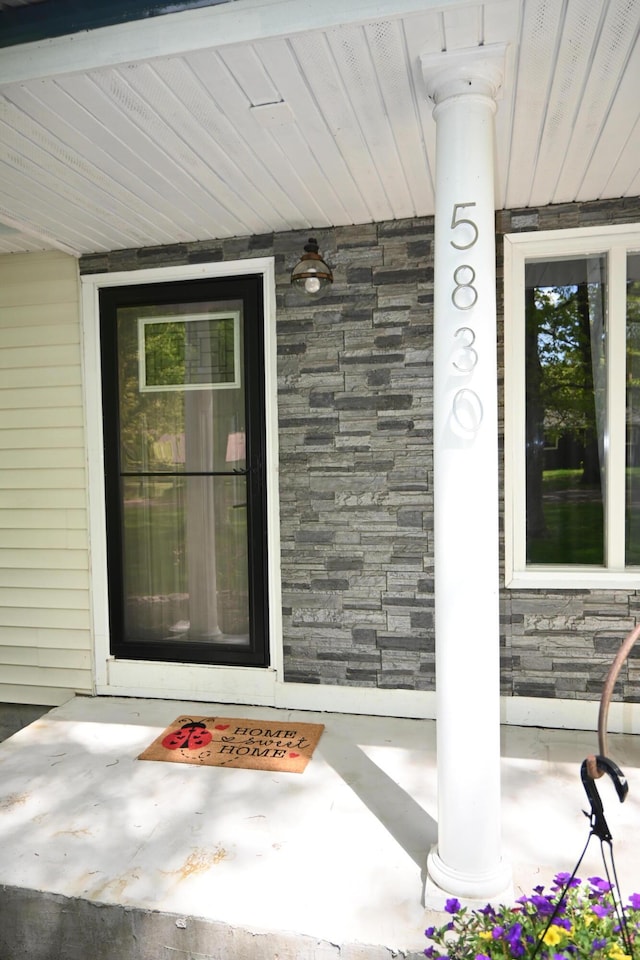 5830 Oneil St, Twin Lake, MI 49457 - view of exterior entry with stone siding