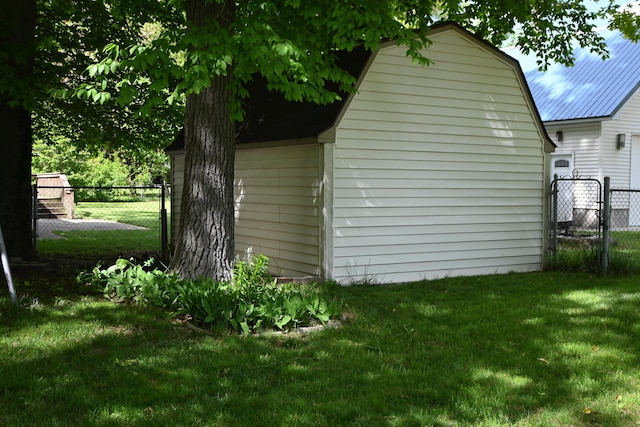 5830 Oneil St, Twin Lake, MI 49457 - view of side of home with a gambrel roof