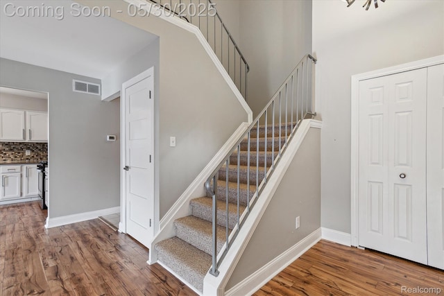 45127 Fair Oaks Dr, Canton, MI 48187 - stairway featuring wood finished floors and baseboards