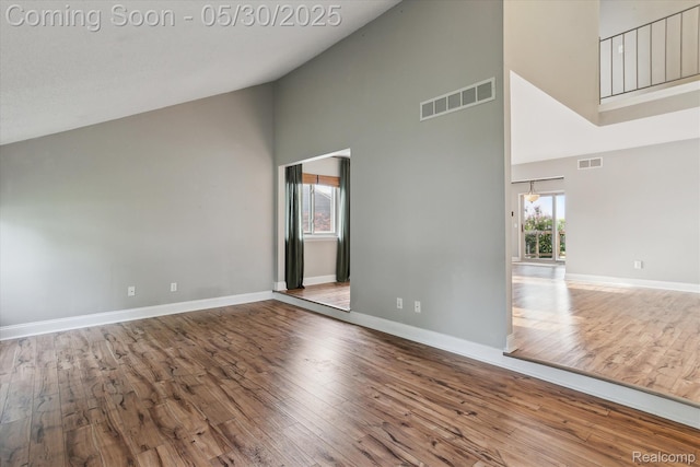 45127 Fair Oaks Dr, Canton, MI 48187 - spare room with high vaulted ceiling, wood finished floors, and baseboards