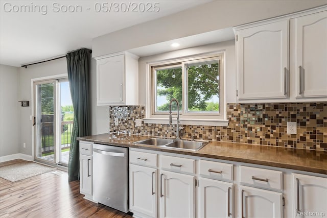 45127 Fair Oaks Dr, Canton, MI 48187 - kitchen with stainless steel dishwasher, a sink, white cabinetry, backsplash, and light wood-type flooring