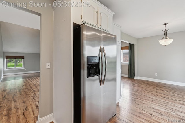 45127 Fair Oaks Dr, Canton, MI 48187 - kitchen featuring stainless steel fridge with ice dispenser, white cabinets, light wood finished floors, and baseboards