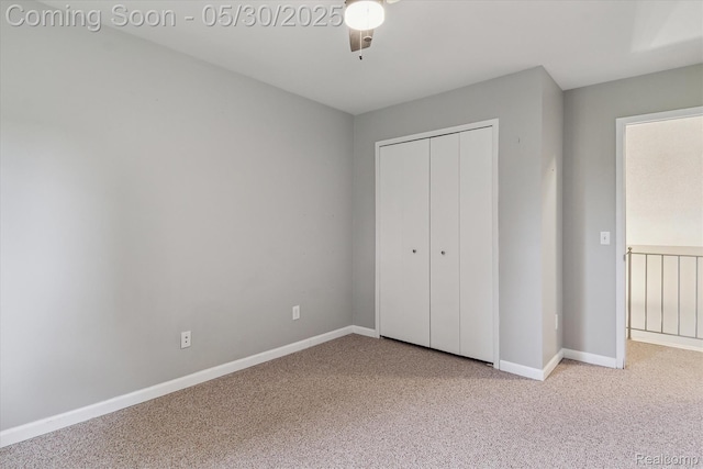 45127 Fair Oaks Dr, Canton, MI 48187 - unfurnished bedroom featuring carpet flooring, a closet, baseboards, and a ceiling fan