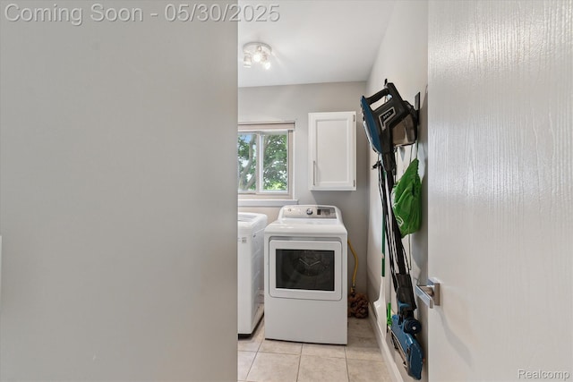 45127 Fair Oaks Dr, Canton, MI 48187 - washroom featuring washing machine and clothes dryer, cabinet space, and light tile patterned floors