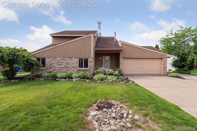 45127 Fair Oaks Dr, Canton, MI 48187 - mid-century modern home with brick siding, an attached garage, driveway, and a front lawn