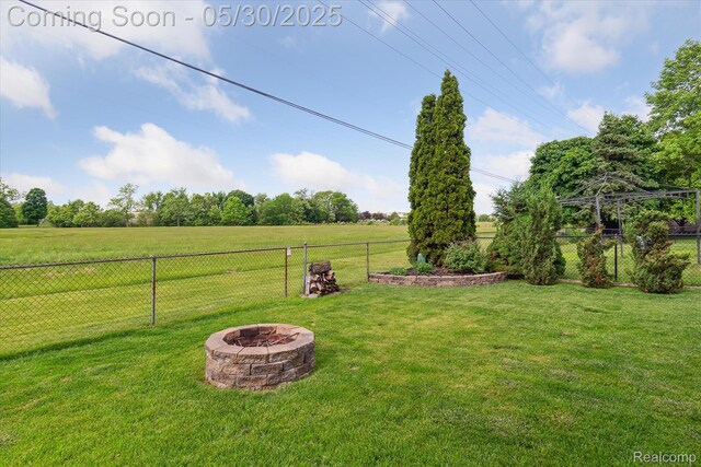 45127 Fair Oaks Dr, Canton, MI 48187 - view of yard featuring an outdoor fire pit