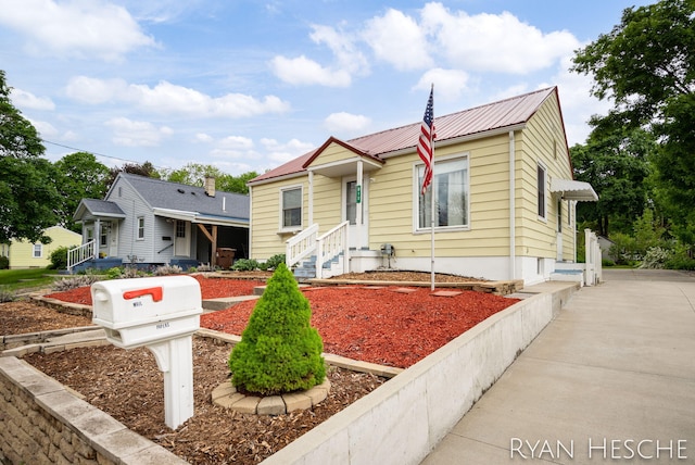 812 Forest St, Ionia, MI 48846 - bungalow-style house featuring metal roof