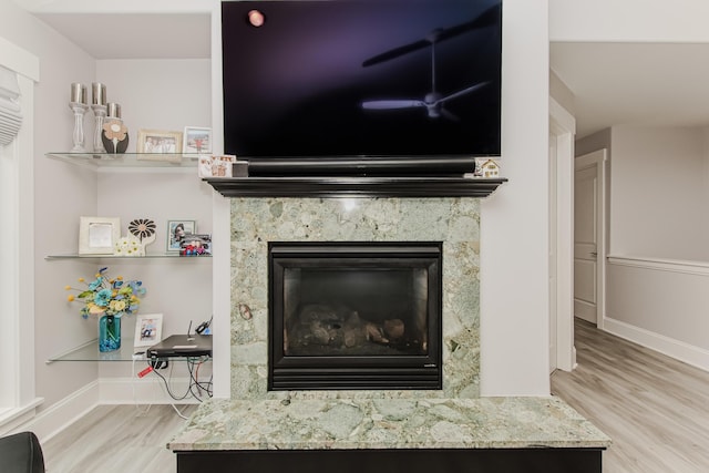 2210 Lindsey Rd, Jackson, MI 49201 - detailed view of wood finished floors, a high end fireplace, and baseboards