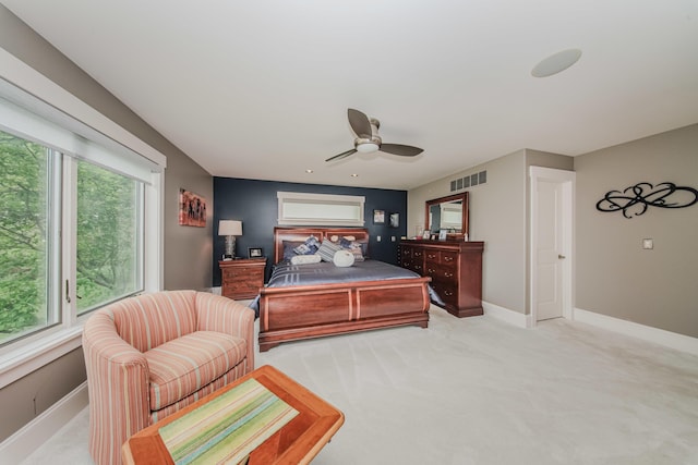 2210 Lindsey Rd, Jackson, MI 49201 - bedroom with multiple windows, baseboards, ceiling fan, and light carpet