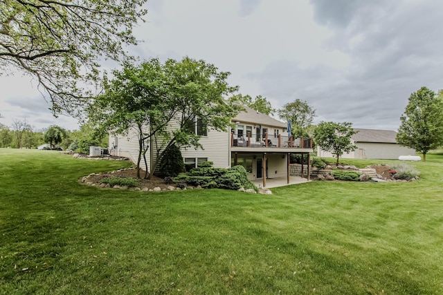 2210 Lindsey Rd, Jackson, MI 49201 - rear view of property featuring a patio area, a deck, and a lawn