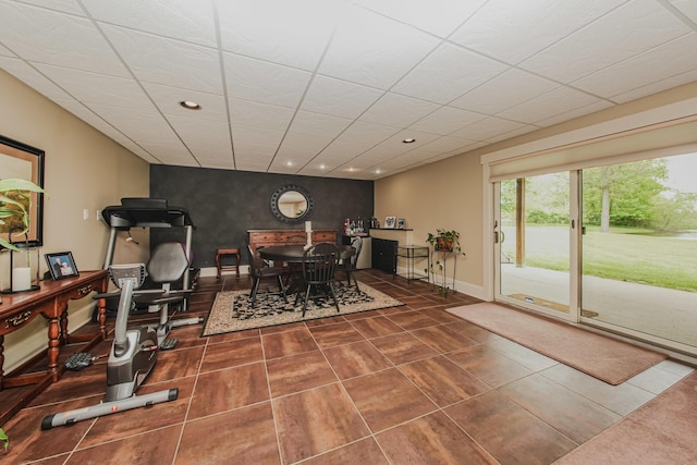 2210 Lindsey Rd, Jackson, MI 49201 - tiled dining room featuring recessed lighting, an accent wall, and baseboards