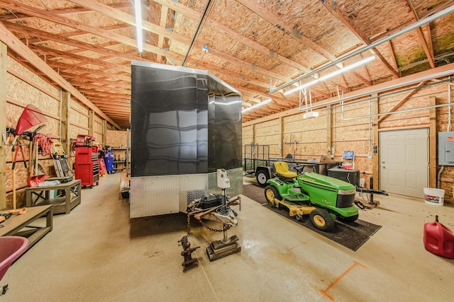 2210 Lindsey Rd, Jackson, MI 49201 - garage featuring electric panel and a garage door opener