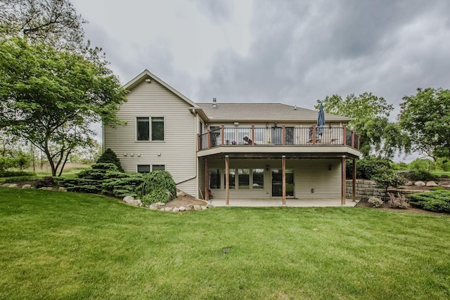 2210 Lindsey Rd, Jackson, MI 49201 - back of property with a patio, a yard, and a wooden deck