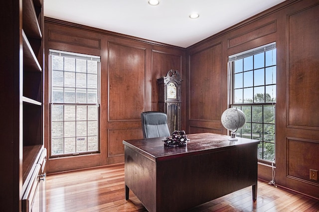 7340 Royal Ridge Dr SE, Caledonia, MI 49316 - home office with light wood-style floors, recessed lighting, and wooden walls