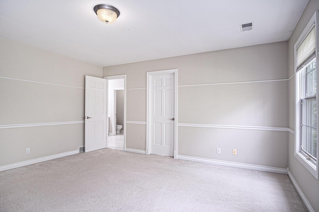 7340 Royal Ridge Dr SE, Caledonia, MI 49316 - unfurnished bedroom featuring carpet flooring and baseboards
