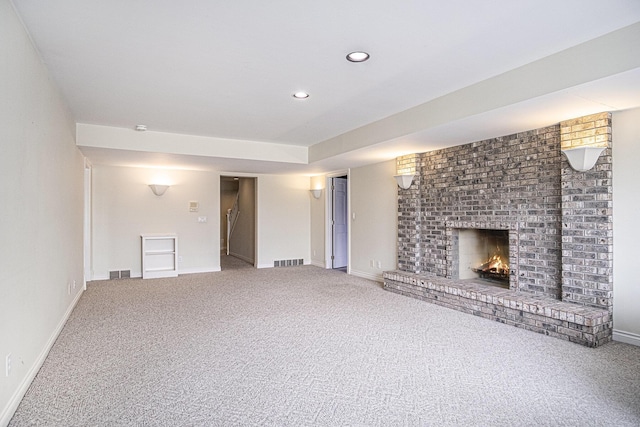 7340 Royal Ridge Dr SE, Caledonia, MI 49316 - unfurnished living room with carpet, a fireplace, baseboards, recessed lighting, and stairway