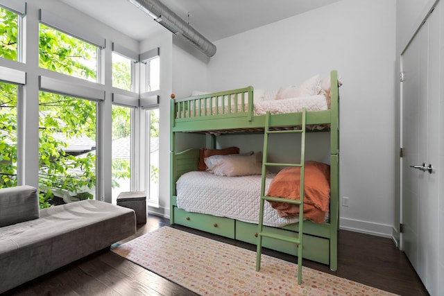 211 W Kingsley St, Ann Arbor, MI 48103 - bedroom featuring wood finished floors, a high ceiling, and baseboards