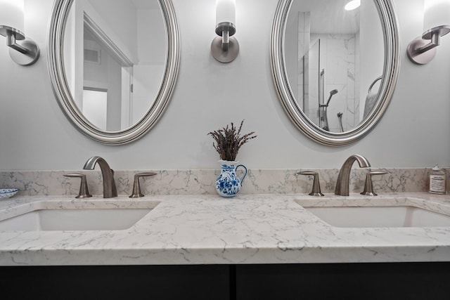 211 W Kingsley St, Ann Arbor, MI 48103 - bathroom with double vanity and a marble finish shower