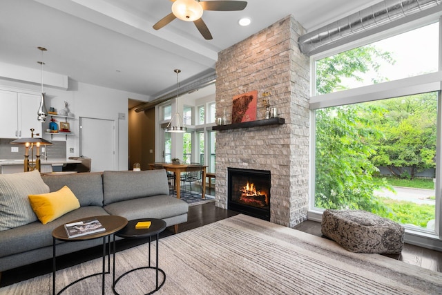 211 W Kingsley St, Ann Arbor, MI 48103 - living room featuring ceiling fan, dark wood-style flooring, a fireplace, and recessed lighting